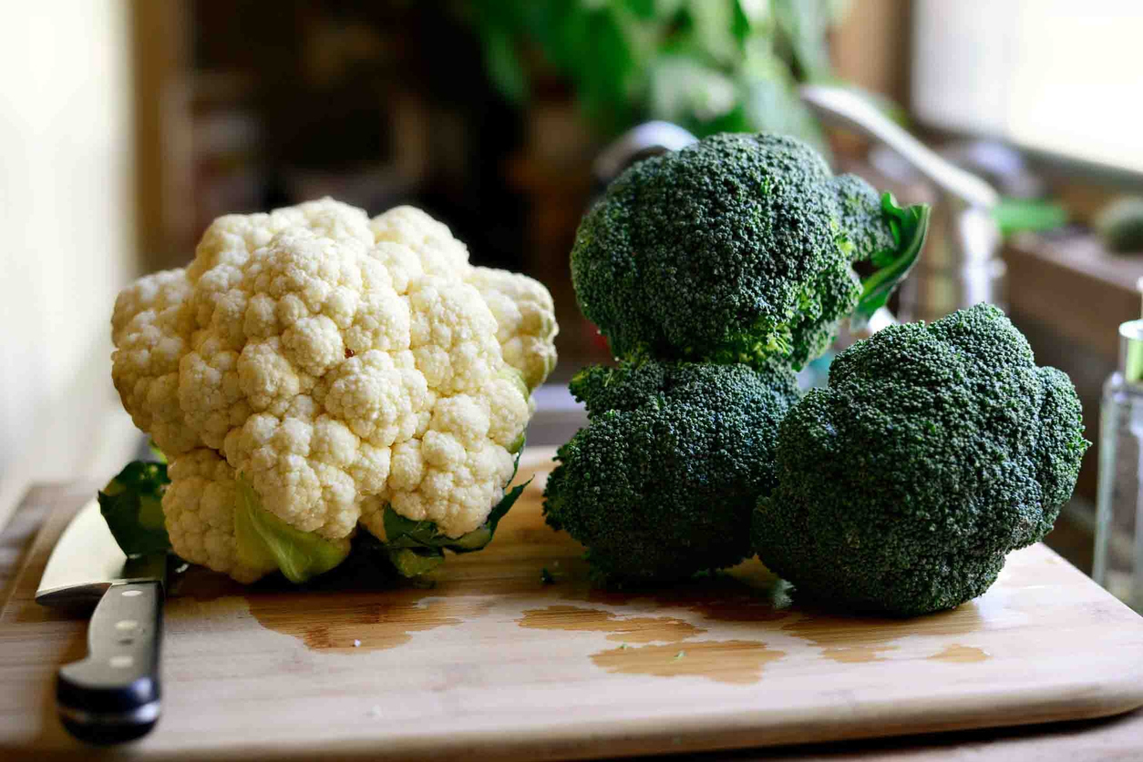 Broccoli and cauliflower on a chopping board