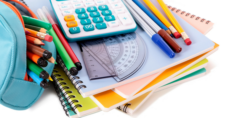 School supplies including markers, notebooks, and a calculator